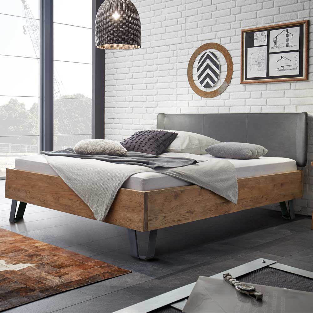 Holzbett Planet aus Wildeiche Massivholz mit Polsterkopfteil in Grau